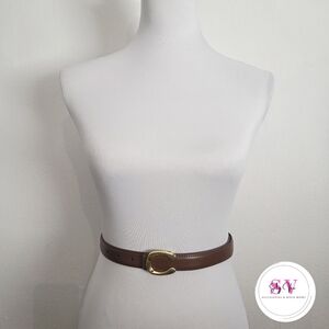 Brown belt with gold buckle